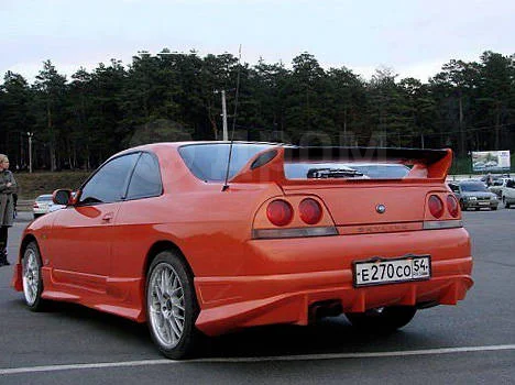 картинка Накладка на задний бампер для Nissan Skyline R33 купе магазин  StreetTuning 